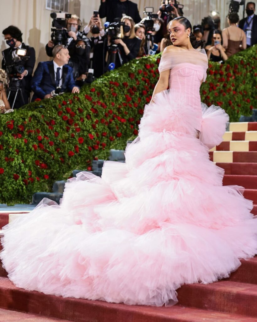 Tessa Thompson's pink Carolina Hererra gown featured one of the evening's most dramatic trains. She completed the look with vegan Piferi boots. Credit: Jamie McCarthy/Getty Images