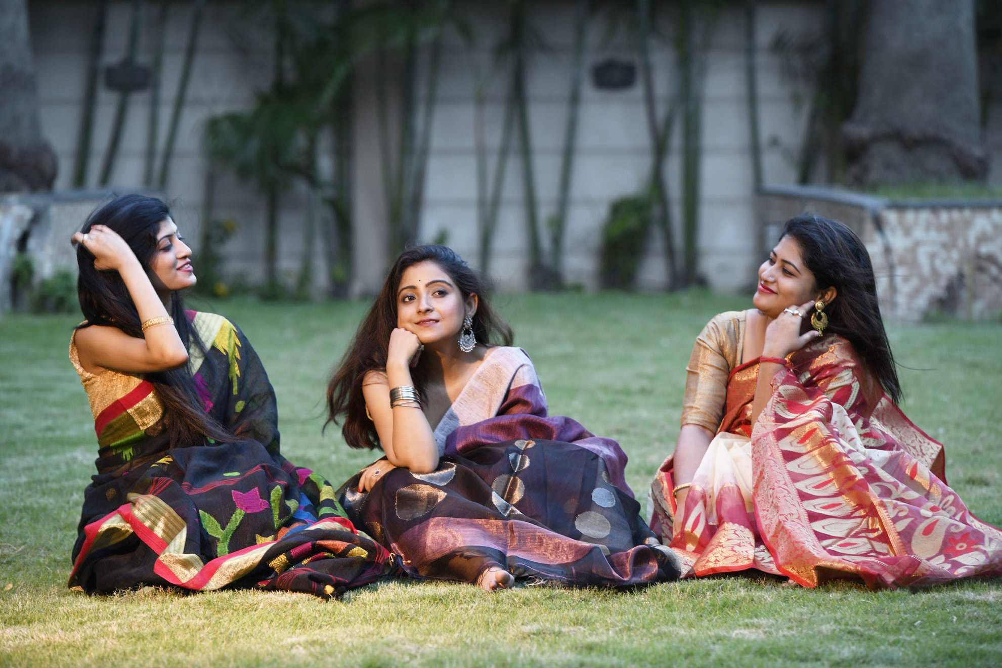 Young Woman in a Colorful Saree Dress and Jewelry Sitting on the Grass ·  Free Stock Photo